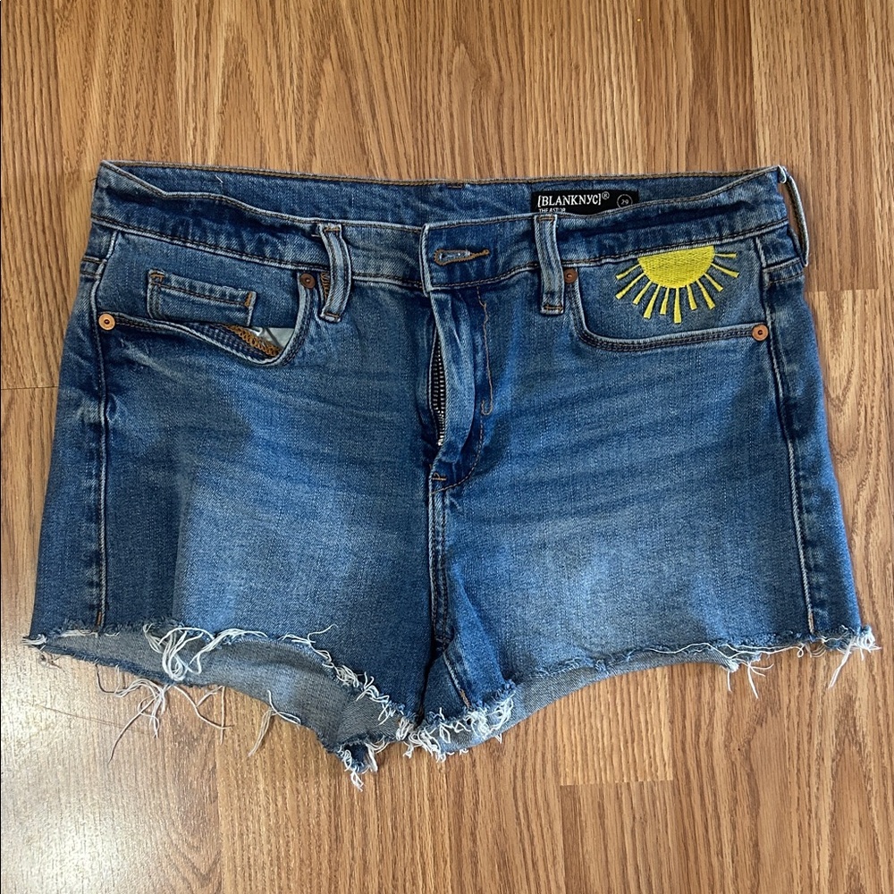 Blank NYC Blue Denim Cutoff Shorts with Yellow Sun Embroidery